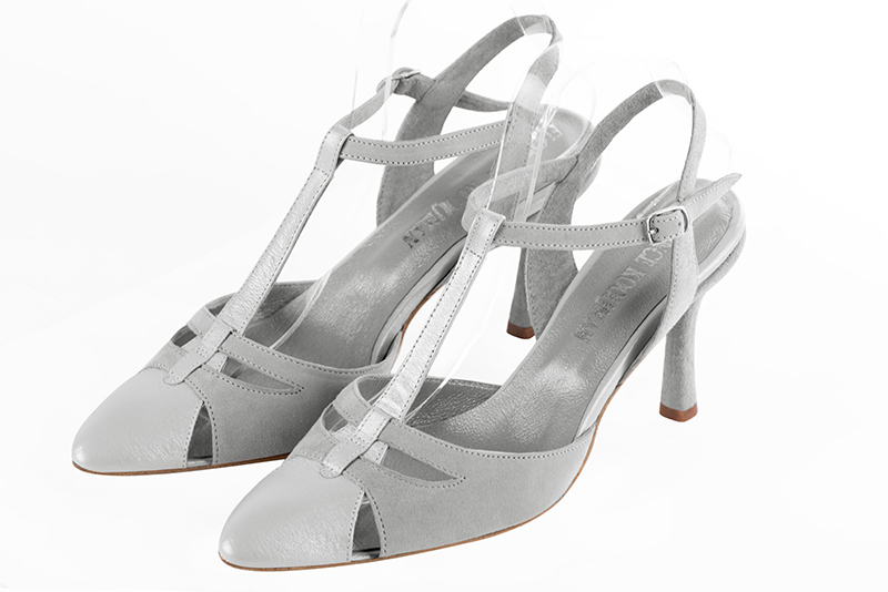 Light silver and pearl grey women's open back T-strap shoes. Tapered toe. High slim heel. Front view - Florence KOOIJMAN